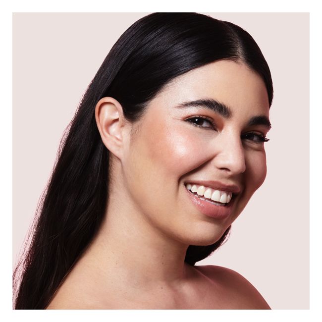 Tata Harper's Peachy Cream blush Model