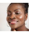 Ere Perez's Carrot Colour Pot Holy Organic tinted balm Model