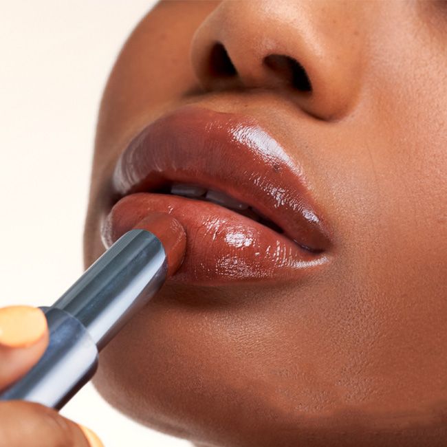 Kosas' Wet Stick sunset simmer tinted lip balm lifestyle